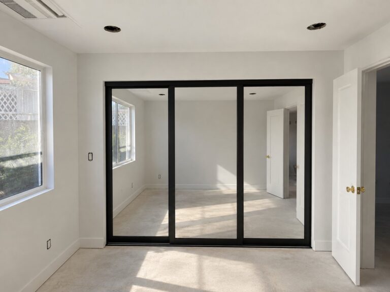 Black 3 panel sliding closet doors installed by The Door Replacement Company, serving Stanton, CA