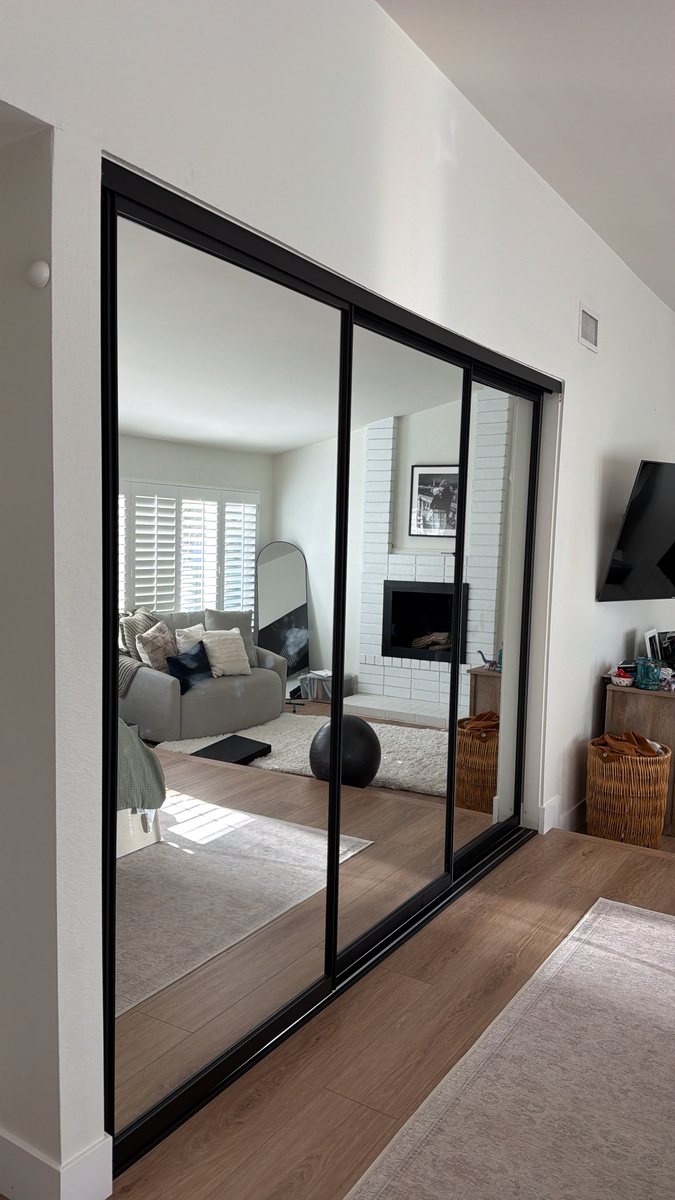 New black frame mirror sliding closet doors installed in Orange County
