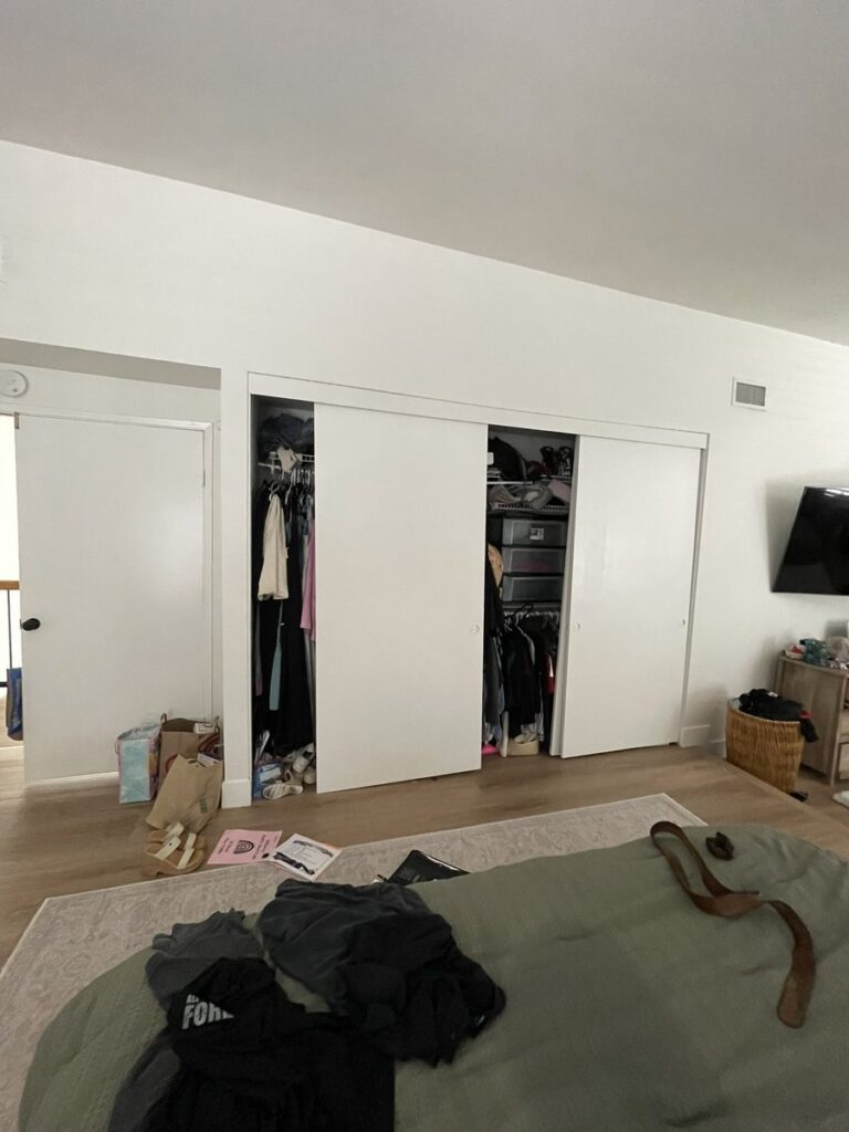 Before: old white bypass closet doors in a San Juan Capistrano, CA home