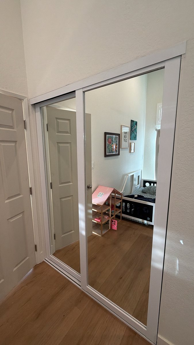 White frame mirror closet doors