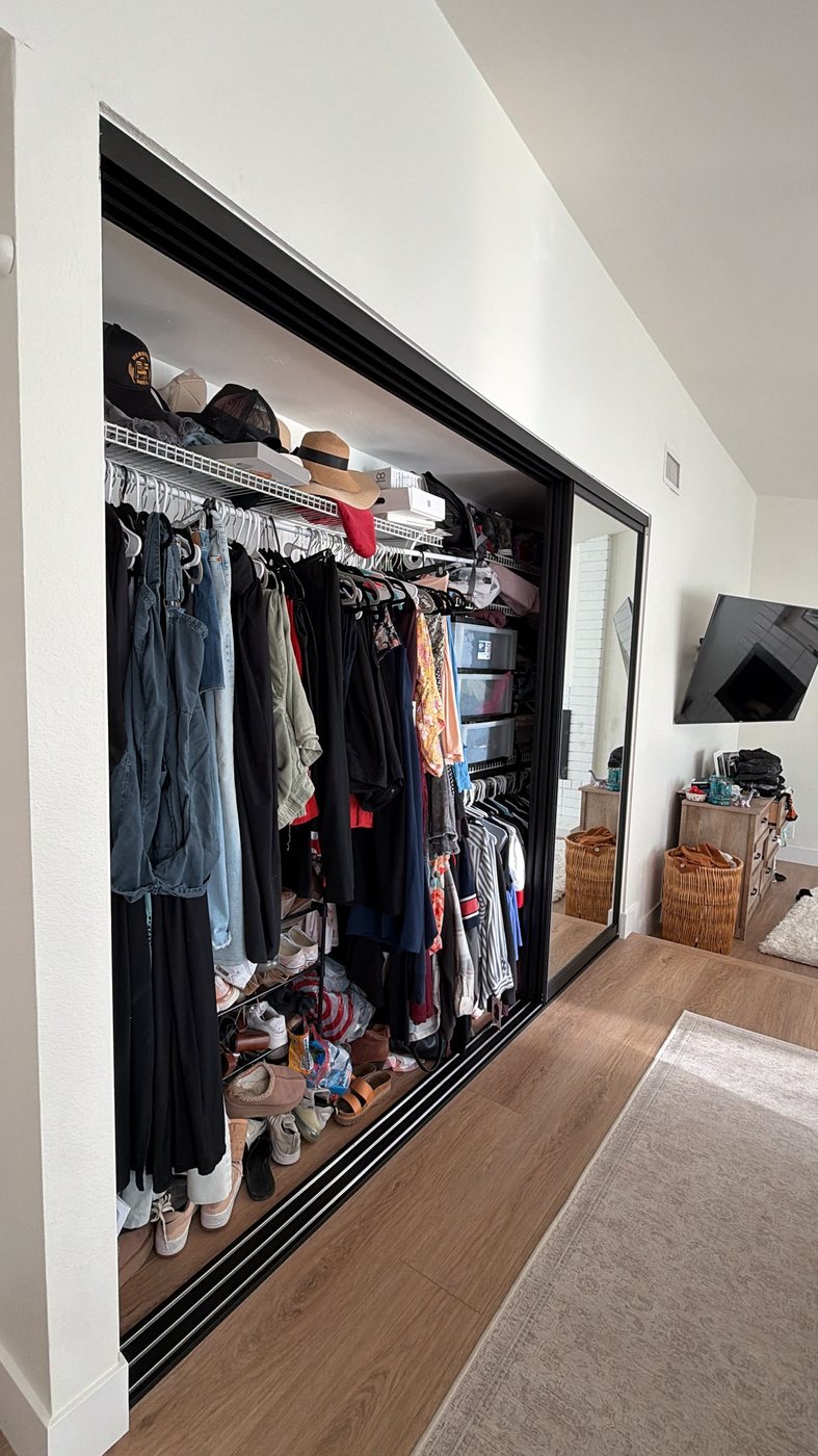 Triple track closet doors stacked to one side